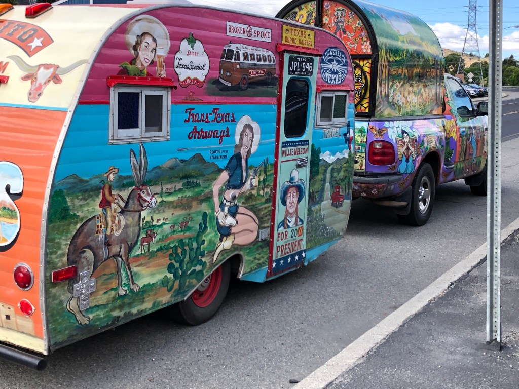 pickup, camper, trailer in mural designs that are very colorful and can be seen from far away