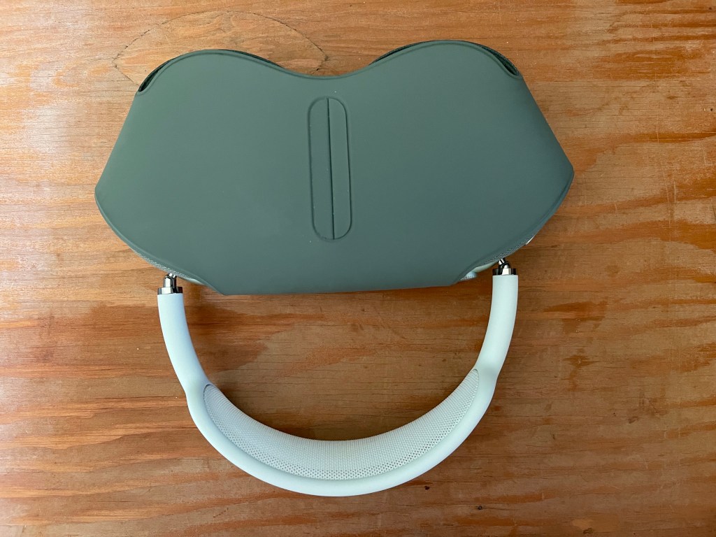 updside down Air Pods Max that show eyes, nose, and big smile