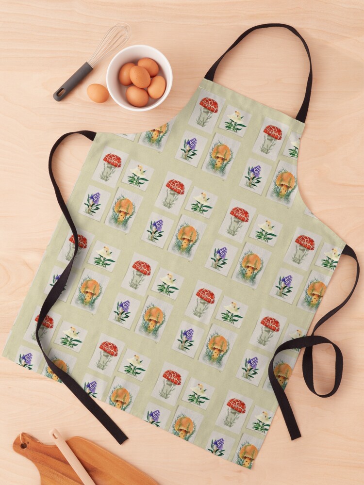 apron with Watercolor of four distinct mushrooms; two with ladybugs; one in the rain