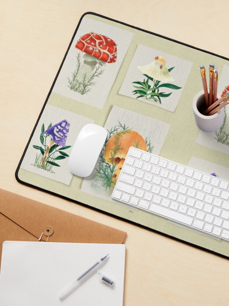 Desk mat / mouse pad of Watercolor of four distinct mushrooms; two with ladybugs; one in the rain
