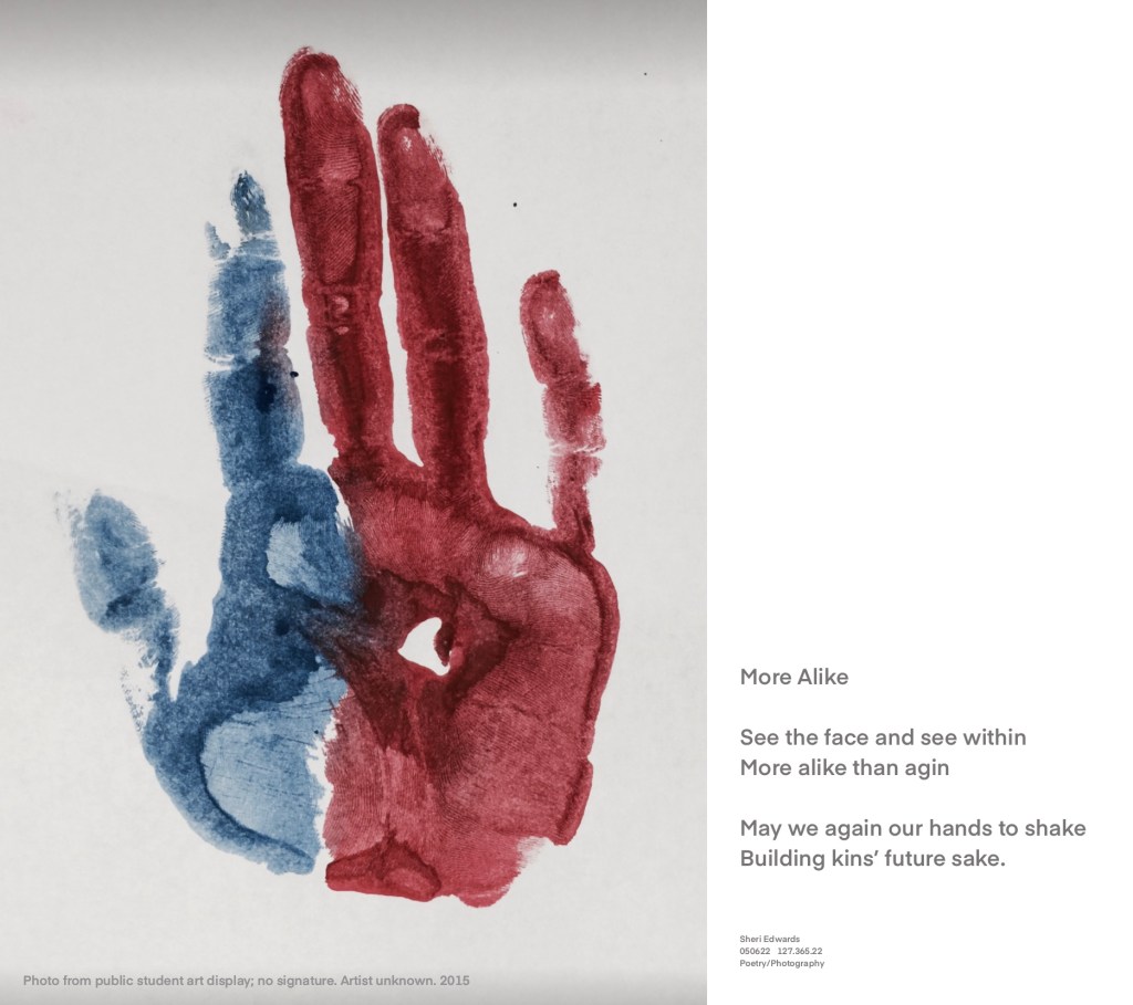 palm of hand painted left half blue right half red with poem in text below