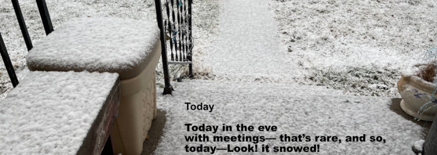 light snow covers the front porch with black railing as well as the sidewalk, street, and lawn