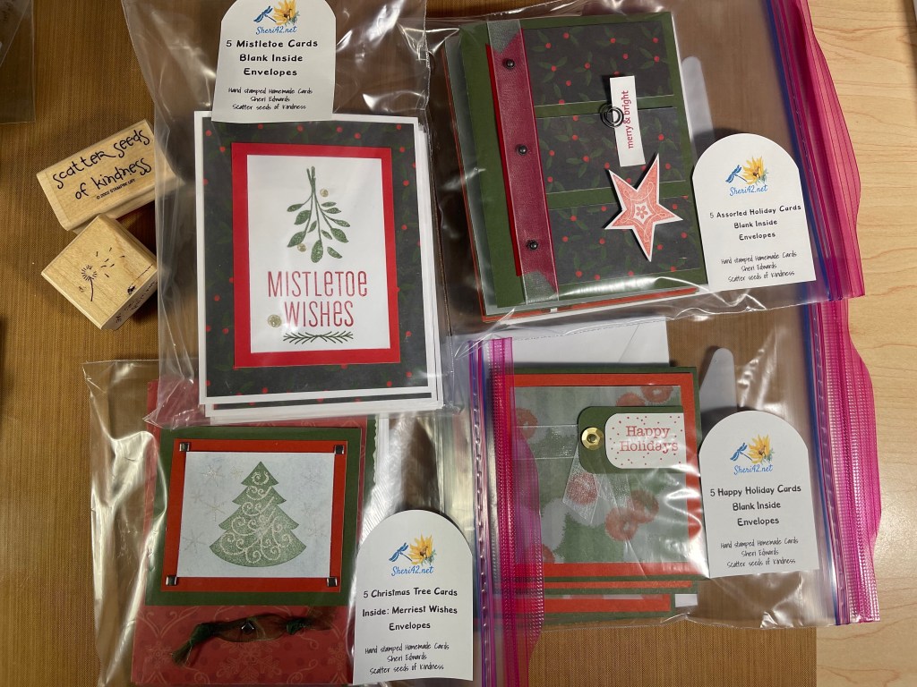 homemade holiday cares in plastic bags, tagged and ready for auction