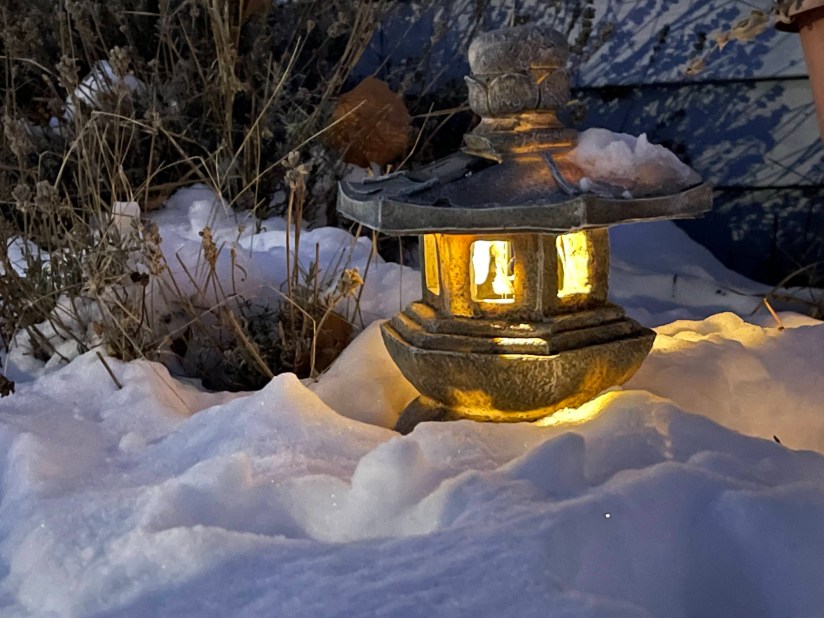 An Ishidoro lantern glowing in the snow