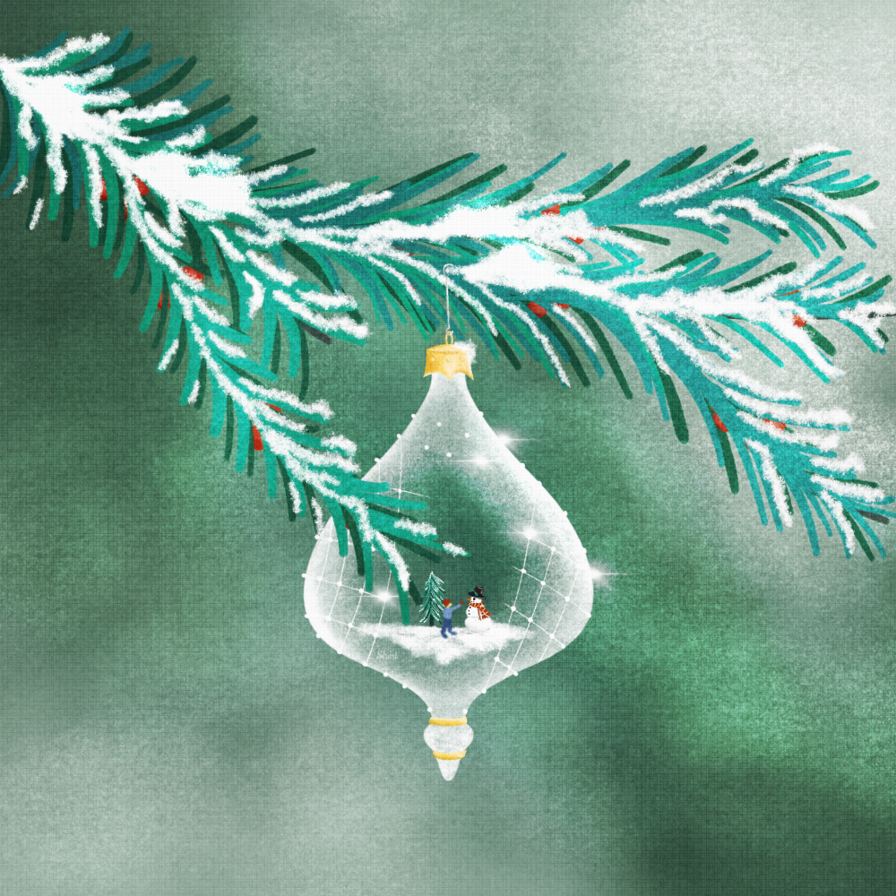 A frosty glass ornament with a boy building snowman hangs from a pine tree with red berries