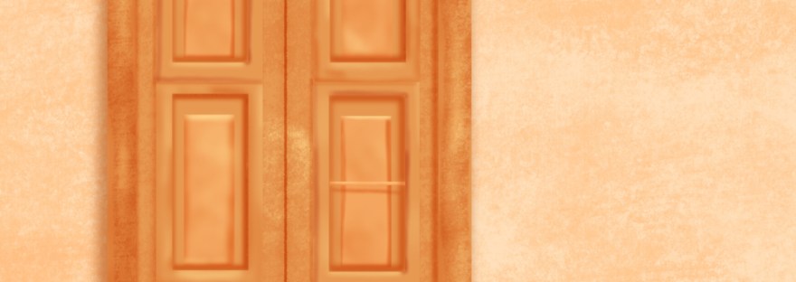 A fancy window on stucco wall on the street