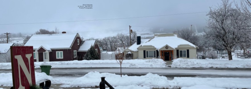 a neighborhood with shoveled bright snow