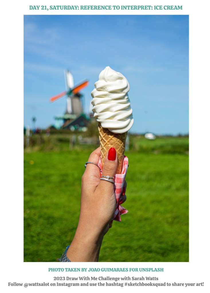 ice cream cone, wrapped in orange checkered napkin and held up in front of blurred windmill by a red finger-nailed hand