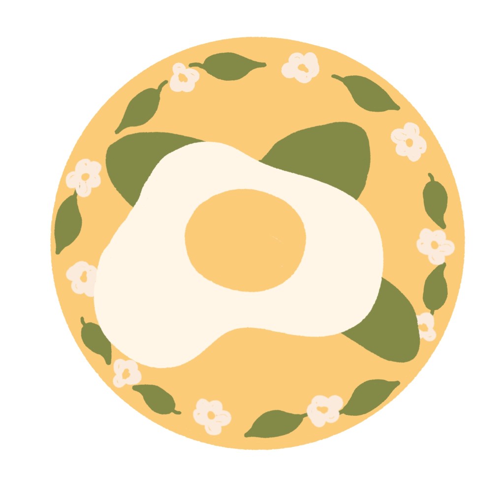 Egg on spinach on flower/leaf decorated plate— all in three colors