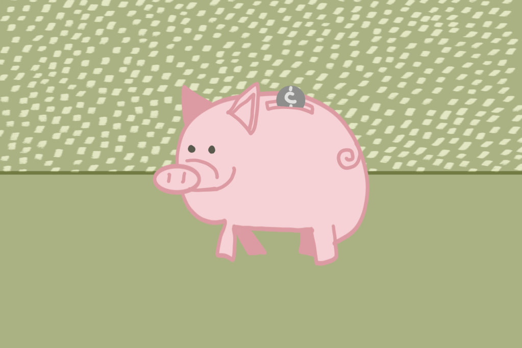 Coin falling into piggy bank