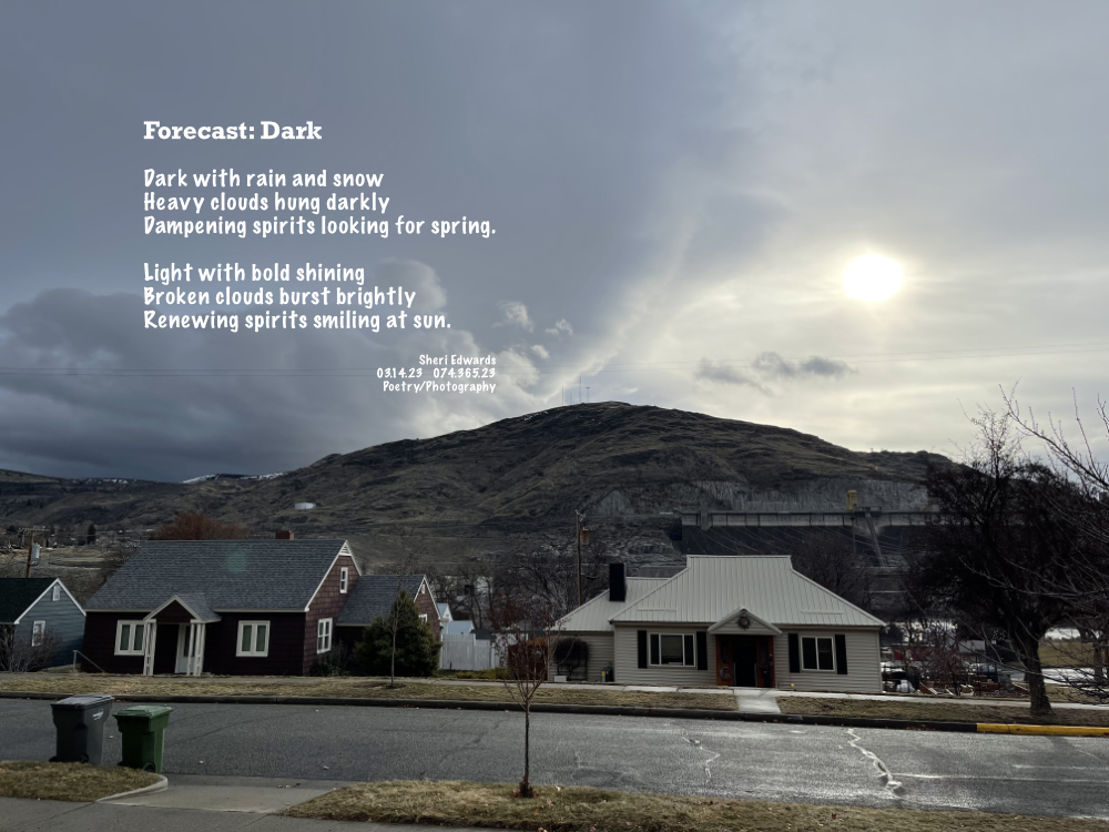 Dark skies broken by a burst of sunlight through the grey