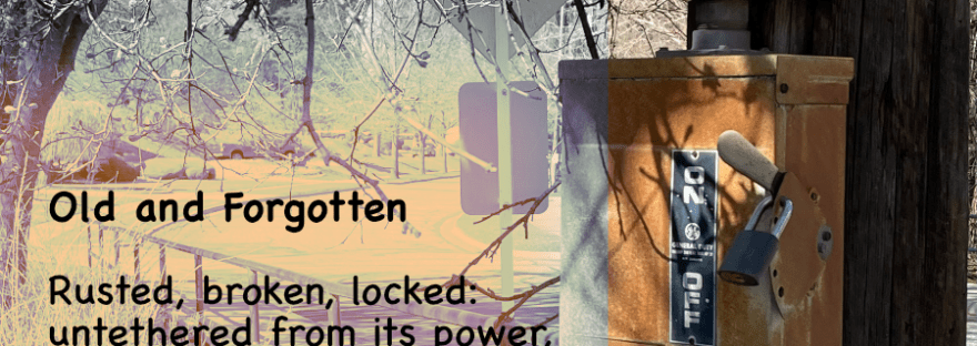 Old power box on pole, locked, broken, disconnected