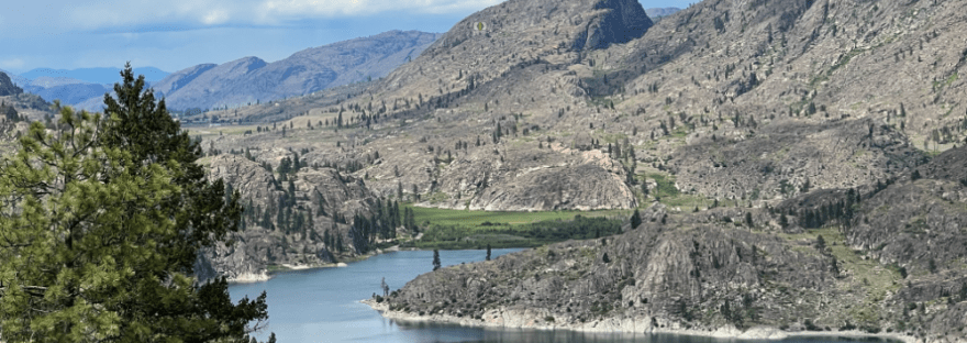Omak Lake, surrounded by granite formed millions of years ago and carved by glaciers tens of thousands of years ago, seems to be guarded by this granite dragon. Scott Hunter, Photo. I added her eye.
