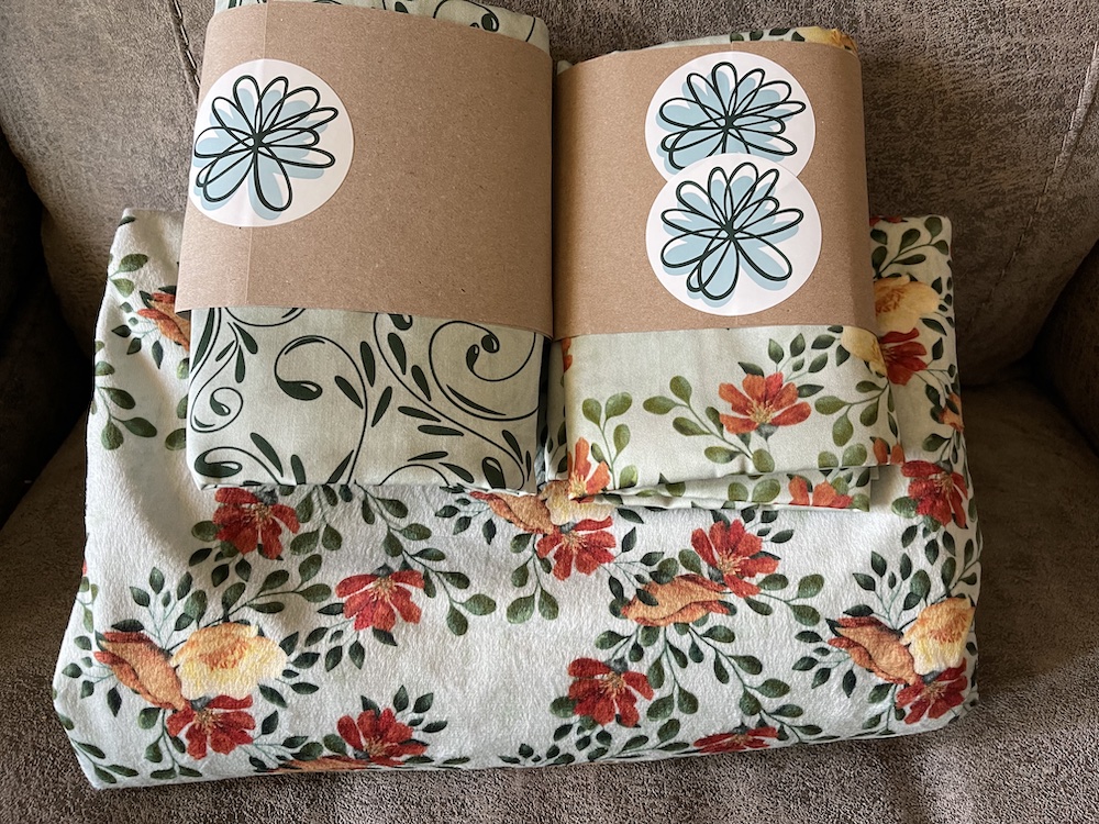 Art designed for a granddaughter to celebrate her wedding; blanket and pillow cases in the colors she chose in her wedding.