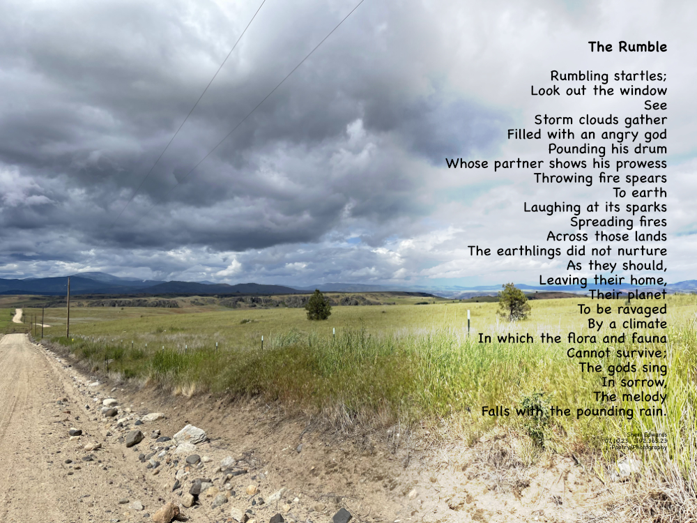 Douglas County looking towards Moses Mountain as the storm clouds gather over the spring green fields. 