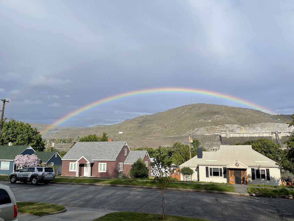 rainbow across the river over yonder hillside