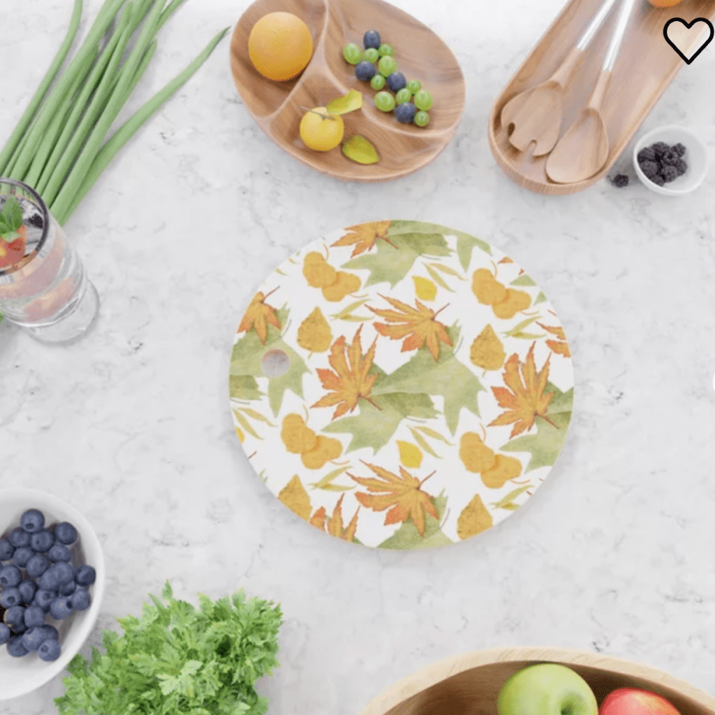 cutting board in autumn leaves pattern by Sheri42 on Society6