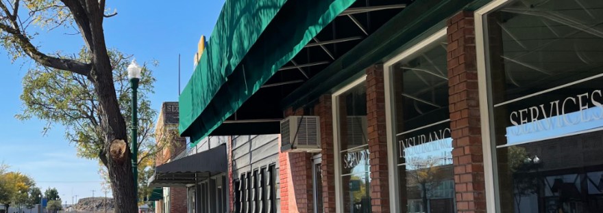 Main road in Odessa, WA Benches in front of store fronts empty, but inviting on a Sunday afternoon in October