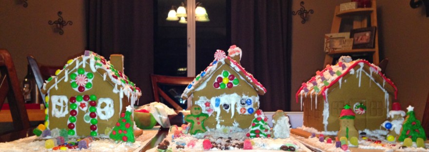 three kid created gingerbread houses