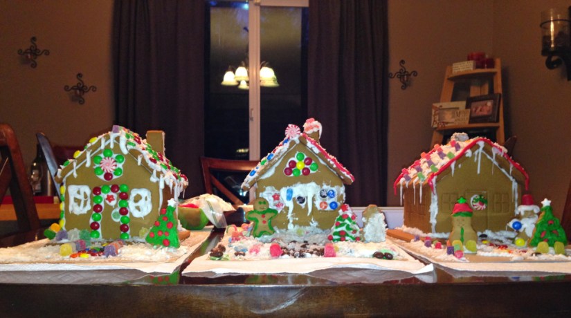 three kid created gingerbread houses