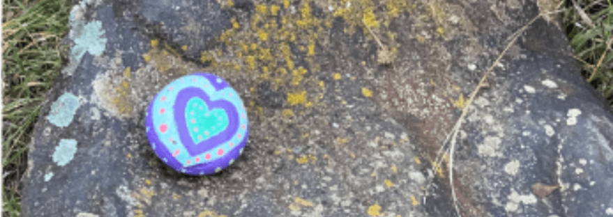 found the same painted rock, again -- concentric hearts with dots around it-- on another path