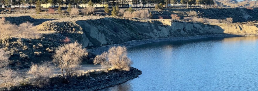 Crescent Bay with basalt boulder in the water near the shore