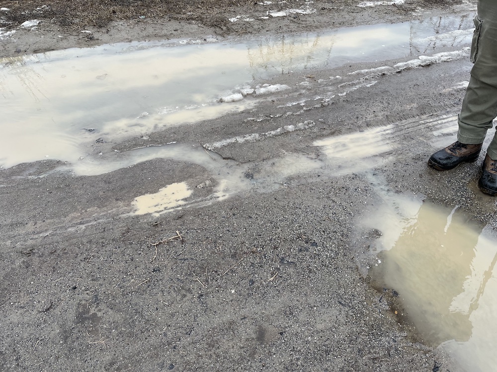 the melting snow and rain create mini-rivers and lakes
