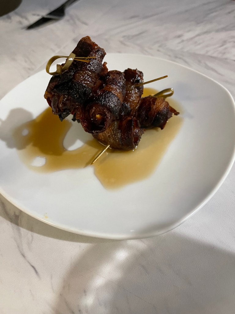 bacon wrapped dates layered like a sculpture