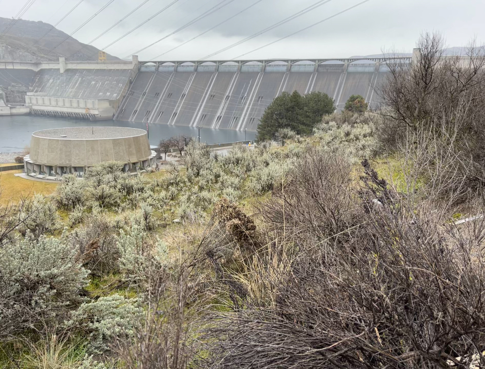 mist rises behind Grand Coulee Dam in February 2024