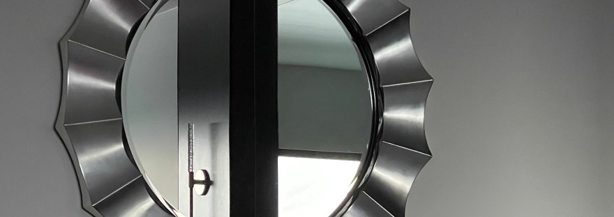 Mirror in the Davenport Grand, it's frame an optical illusion