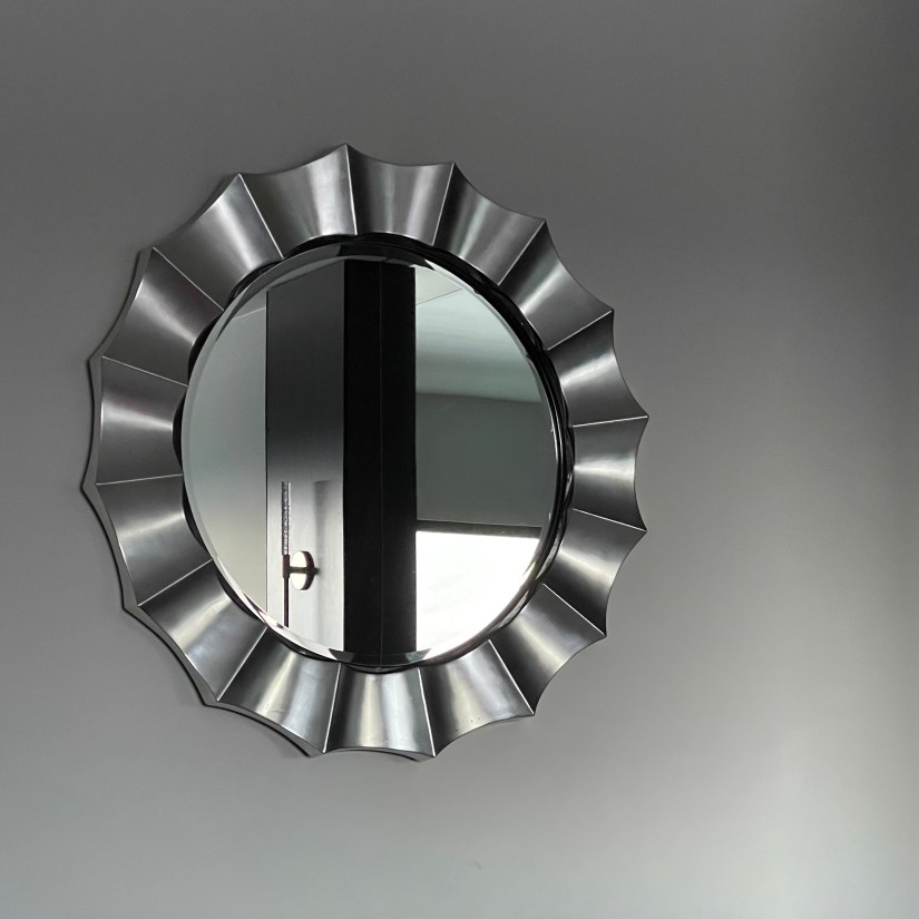 Mirror in the Davenport Grand, it's frame an optical illusion