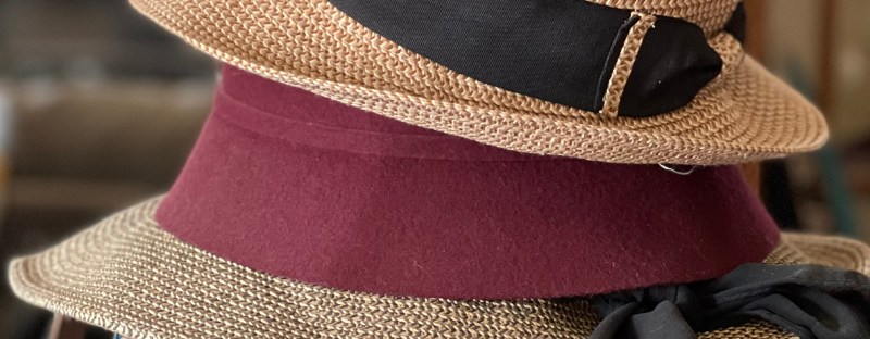 hats stacked on books stacked