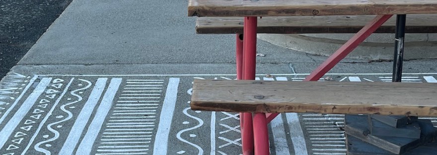 a few dots in a motif painted like a rug under the picnic tables of our favorite Voltage Coffee House. Cute. Clever.
