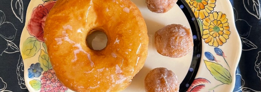 Flickr 21 Challenge entry prompt: donut: I found a donut and three donut holes for my husband, served in style on a bright floral plate.