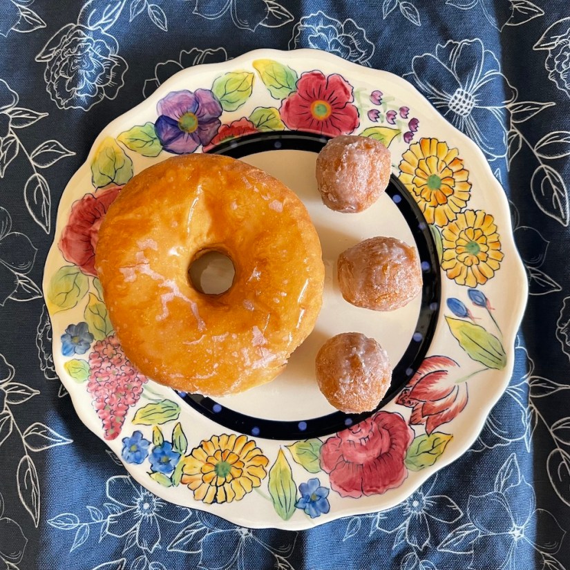 Flickr 21 Challenge entry prompt: donut: I found a donut and three donut holes for my husband, served in style on a bright floral plate.