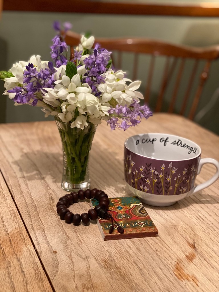 daughter's photo of the bouquet she made and other items on her kitchen table